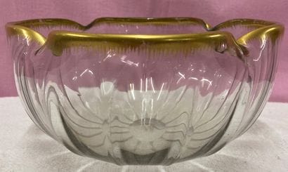 DAUM, Nancy. A four-lobed crystal bowl with...