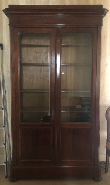 
Mahogany and mahogany veneer bookcase. The...