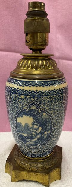 Earthenware ovoid vase decorated in blue...