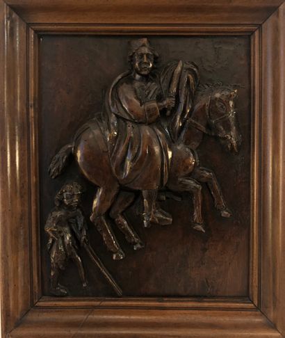 Panel in fruit wood and carved representing...