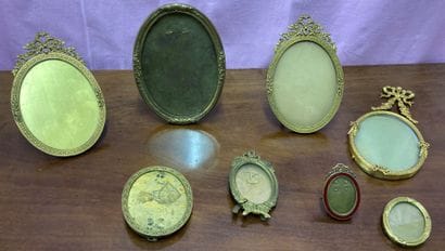 Set of eight oval-shaped gilt brass picture...