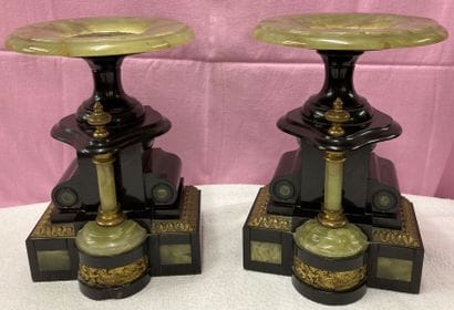 Black marble and onyx mantel adorned with...