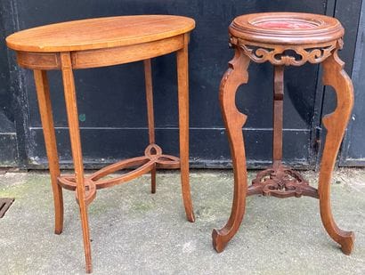 Set of two pedestal tables : - one oval in...