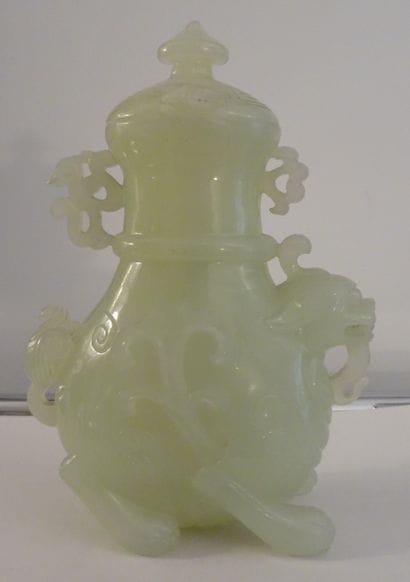 CHINA, 20th century. Set in celadon serpentine:...