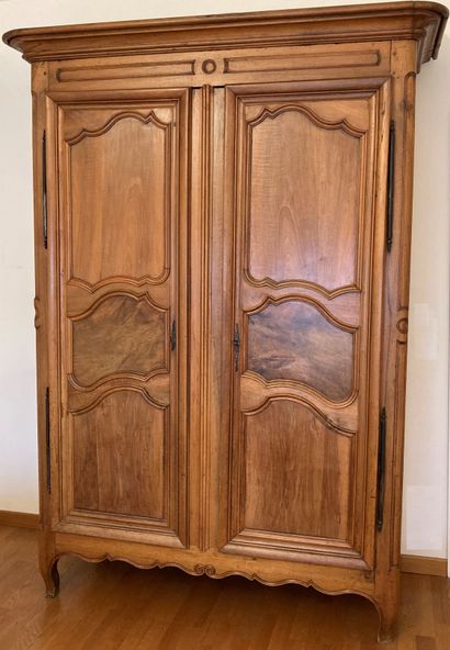 Cabinet in molded fruitwood, the doors with...