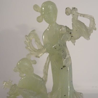 CHINA, 20th century. Set in celadon serpentine:...