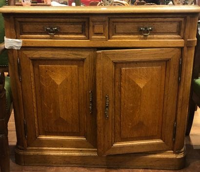 Small molded oak sideboard, the angles rounded,...
