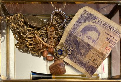 Box of fake jewels including a metal bra...