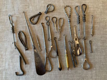 Set of metal boot pullers, some retractable,...