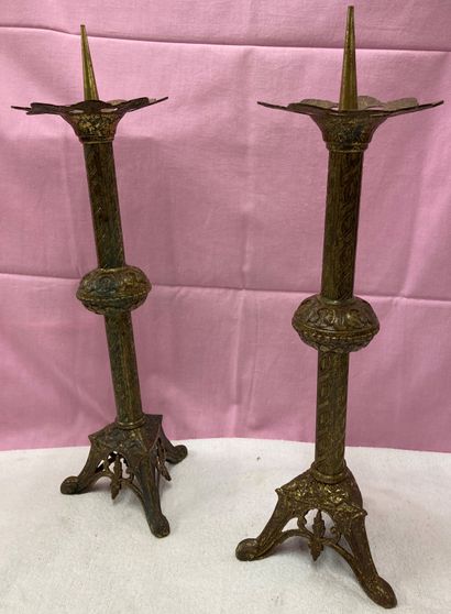 Pair of gilded metal candlesticks, the pierced...