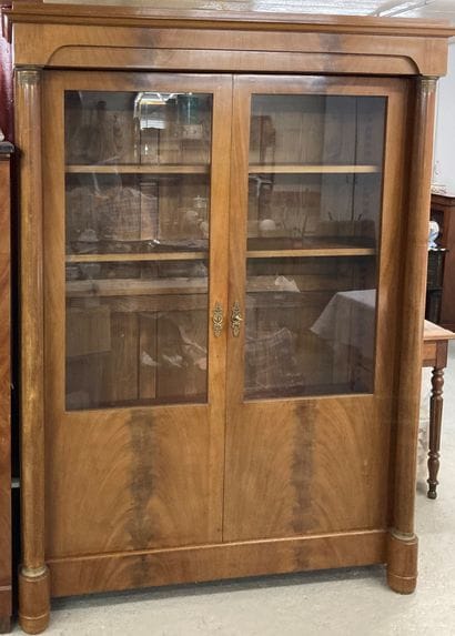 Mahogany and mahogany veneer showcase, the...