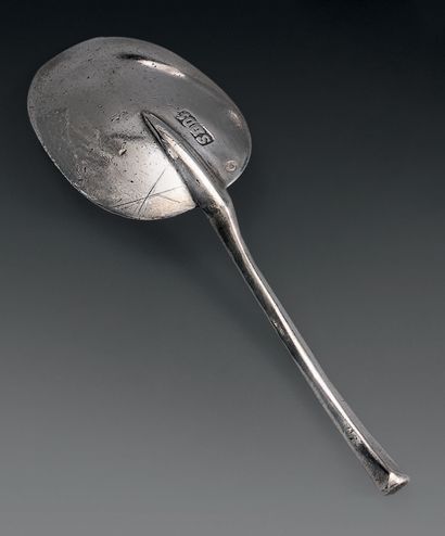 Spoon in silver, the handle with sides, the...