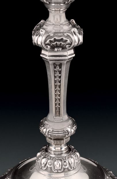 Pair of silver torches and two candlesticks,...