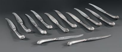 Twelve silver knives, the handles stuffed...