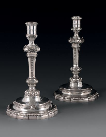 Pair of silver torches and two candlesticks,...