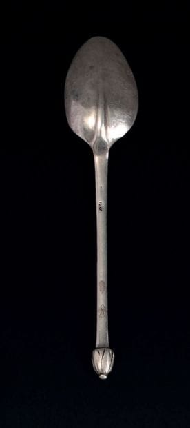 Small silver spoon, the handle finished in...