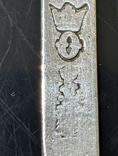 A silver spoon and fork, the handle straight,...