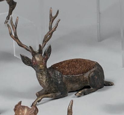 Reclining deer, forming a pin holder. 
H....