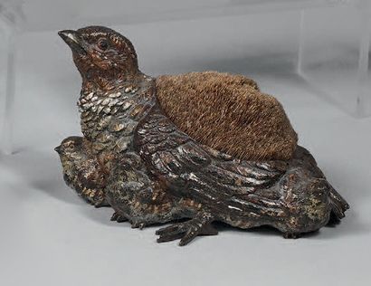 Partridge and its chicks forming a pin holder....