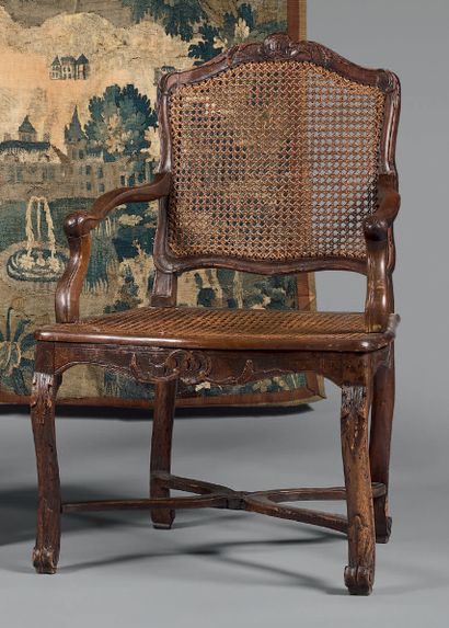 Armchair in natural wood molded and carved...