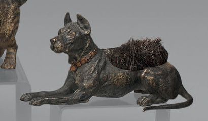 Dobermann lying down and forming a pin holder....