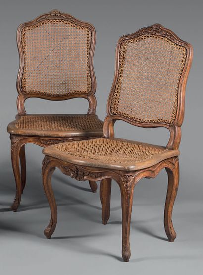 Two chairs in natural wood molded and carved...