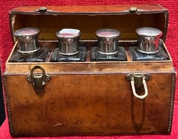 Saddle-stitched leather travel case, containing...
