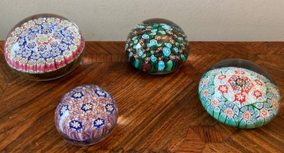 Four paperweights with millefiori decora...