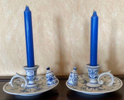 Pair of porcelain hand candlesticks decorated...