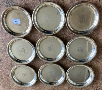 Suite of nine coasters out of silver plated...
