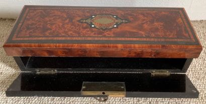 Three glove boxes : - one in burr, the lid...