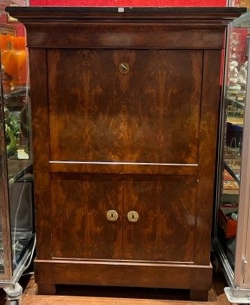 Mahogany and mahogany veneer secretary. Opens...