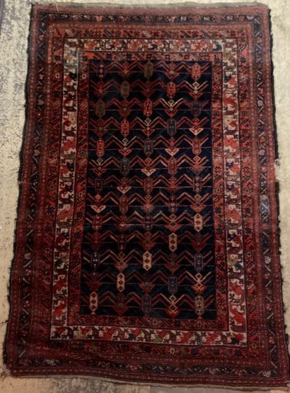 Oriental wool carpet decorated with a stylized...