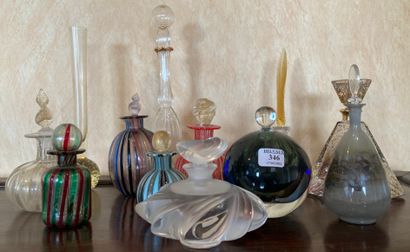 Eleven bottles out of glass or crystal, with...