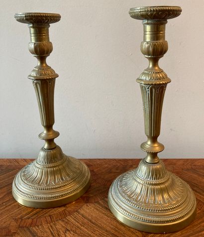 Pair of brass torches decorated with channels...