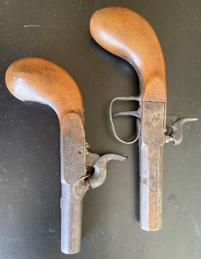 Two steel flintlock pistols, wooden stocks....