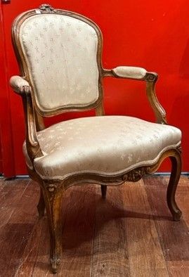 
Armchair in natural wood molded and carved...