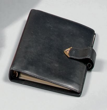 CARTIER
Book. Black leather agenda cover,...