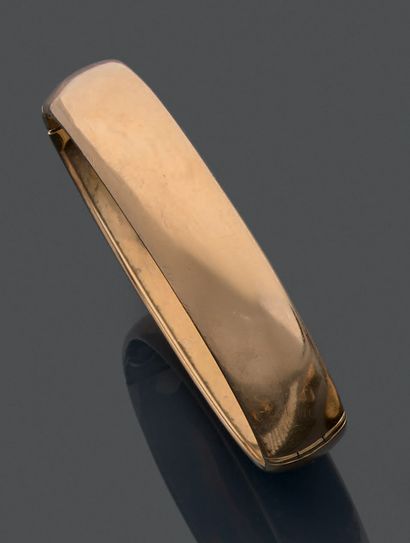 Bracelet jonc ouvrant en or jaune uni 18K...
