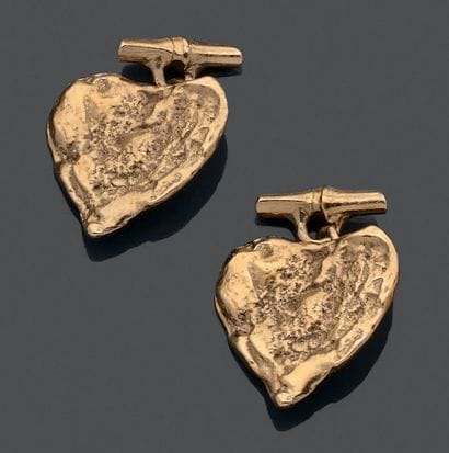 YVES SAINT LAURENT.
Pair of gilded metal...