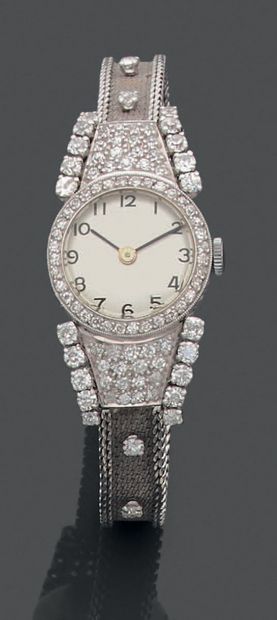 Montre de dame en platine et or gris 18K...