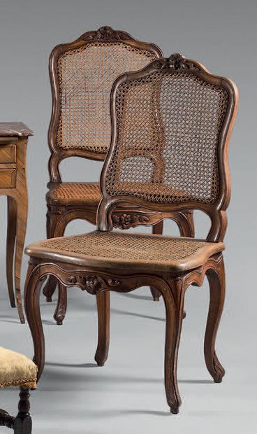 Two chairs in natural wood molded and carved...