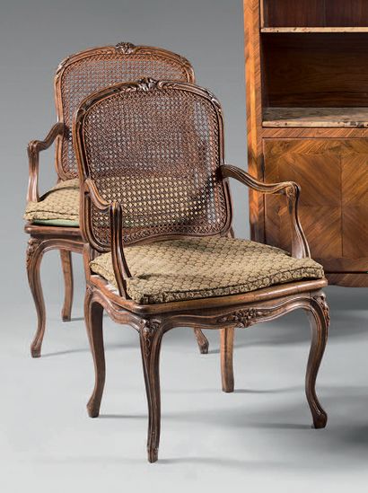 Pair of armchairs in natural wood molded...