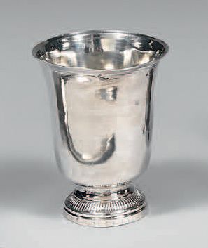 A plain silver tulip-shaped kettle, standing...