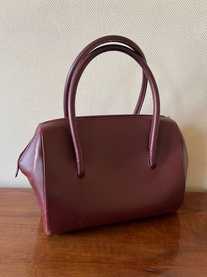 MUST by CARTIER. Small handbag in burgundy...