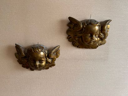 Pair of elements in carved wood with a cherub's...