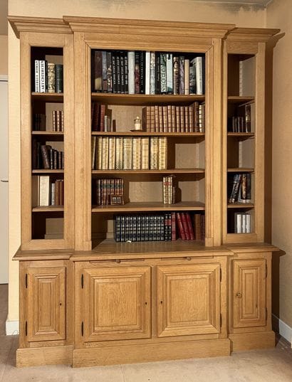Bookcase in molded light oak, with central...