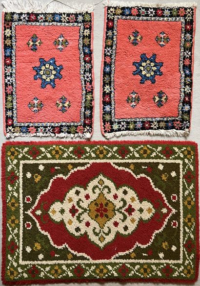 Rugs: a Moroccan carpet with a beige background,...