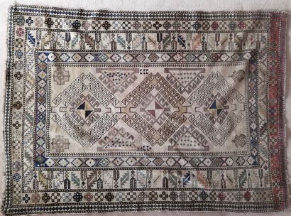 Oriental wool carpet decorated with three...
