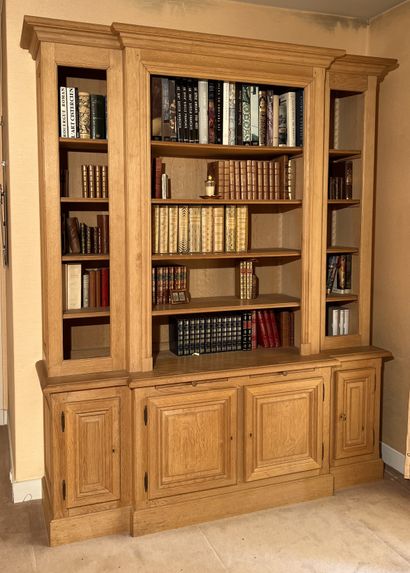 Bookcase in molded light oak, with central...